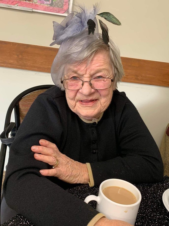 Resident work on a flower arrangement