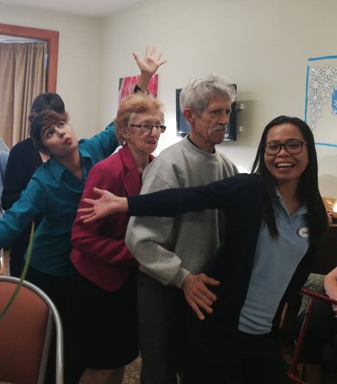 Staff and residents dancing at Admatha