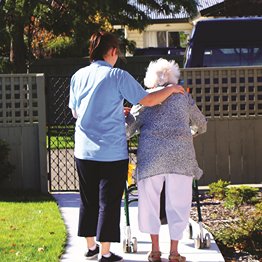 Staff member hugging resident